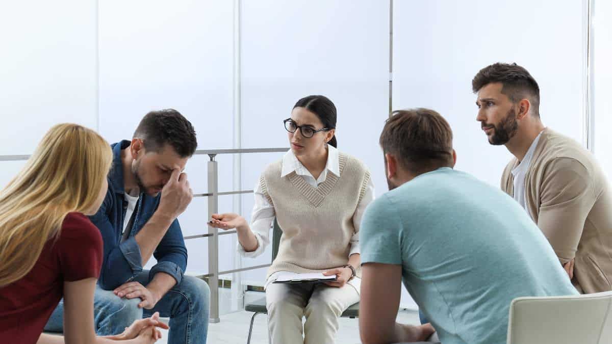 Patients discussing the long term effects of meth addiction during group therapy.